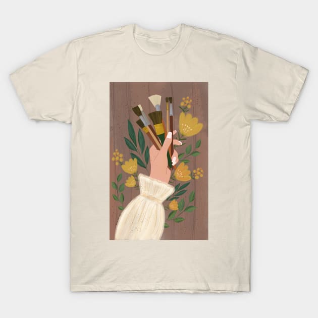 Woman's hand holding paint brushes surrounded by flowers T-Shirt by SanMade